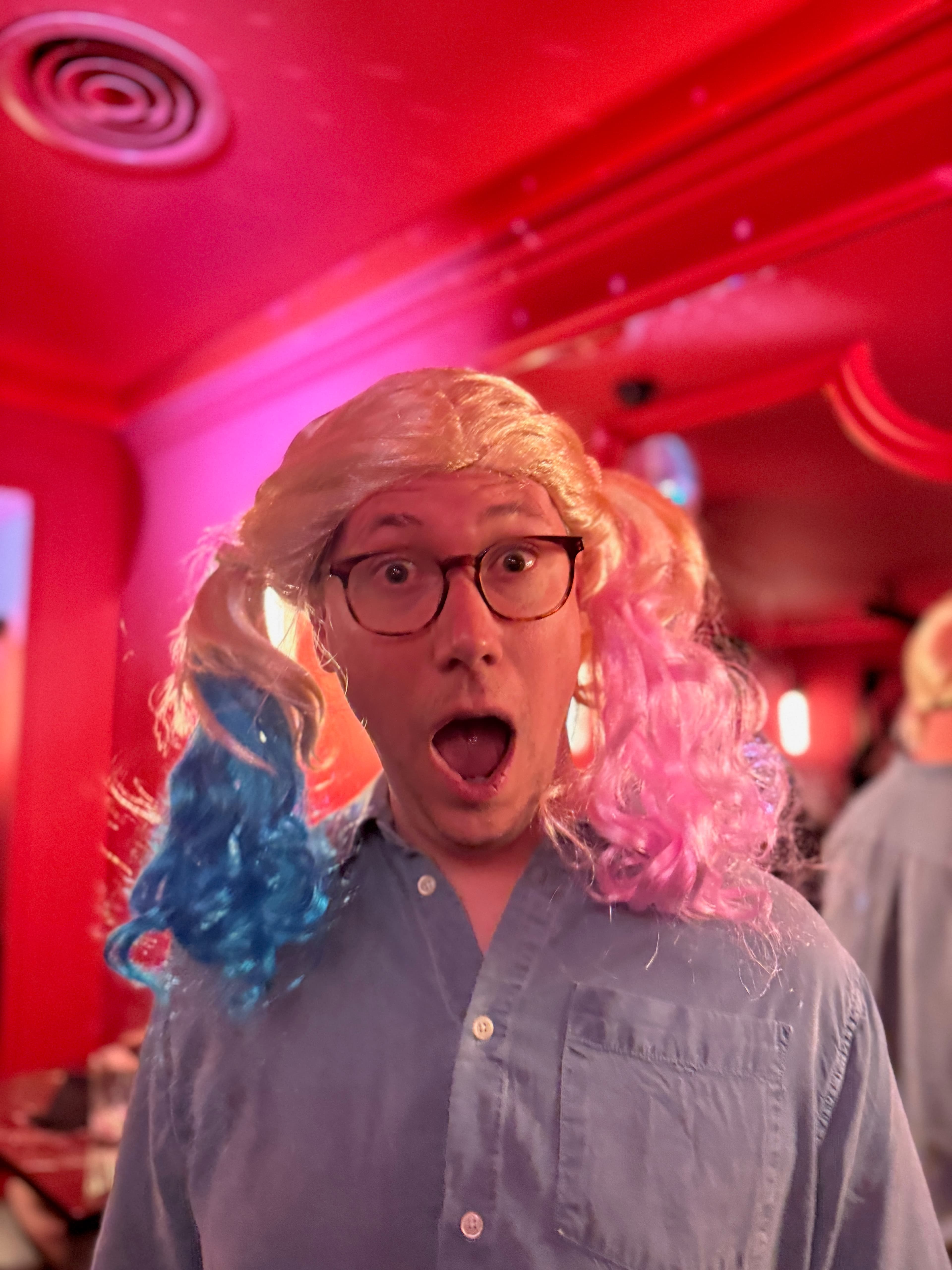 Portrait from the latest photo drop with strong red party lighting
